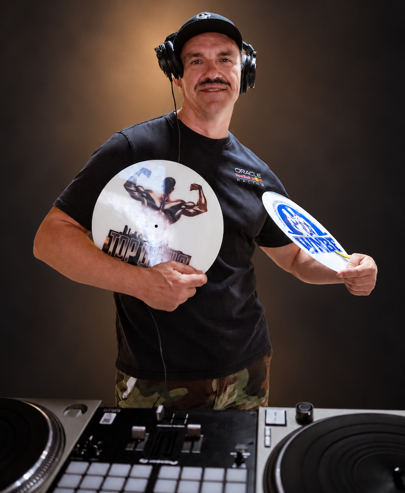 IV Static in the studio, surrounded by DJ equipment
